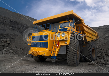 Photo of the big mine truck. Photo of the big mine truck. stock photo, A picture of a big yellow mining truck at worksite. by miloslav78