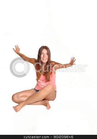 Girl having fun. Girl having fun. stock photo, A teenager, sitting on the floor in the studio, is exited and having fun
in front of the camera, in bare feet for white background.
by Horst Petzold