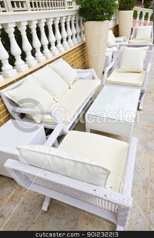 Patio furniture outdoor Patio furniture outdoor stock photo, Wicker patio furniture outdoor in area paved with natural stone by Elena Elisseeva