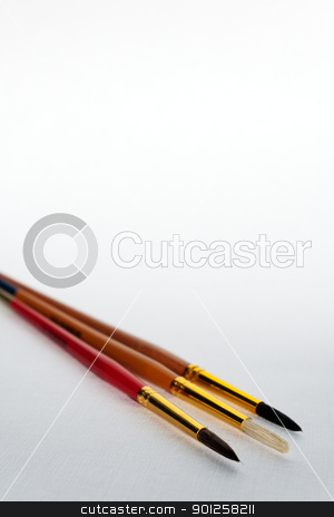 To use this stock image in your creative project, please select the size you need over to the right and click the "Add to Cart" button.
Your downloaded image will come with the Cutcaster watermark removed so don’t worry about the watermark you see on this page. Art brush template stock photo, Three art brushes on a white canvas paper for your artistic project by Imaster