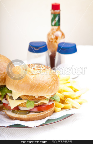 Vertical close-up on chicken scallop burger Vertical close-up on chicken scallop burger stock photo, Vertical close-up on juicy huge chicken scallop burger by Zaid Saadallah
