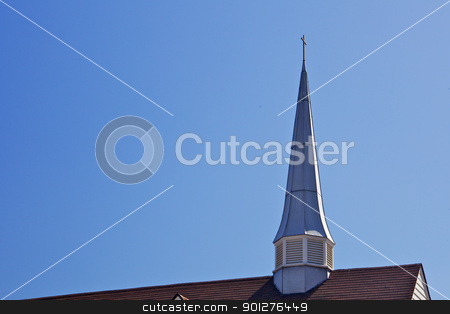 Thin Church spire Thin Church spire stock photo, Thin Church spire and partial roof against a blue sky by bobkeenan