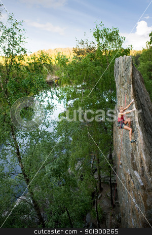 To use this stock image in your creative project, please select the size you need over to the right and click the "Add to Cart" button.
Your downloaded image will come with the Cutcaster watermark removed so don’t worry about the watermark you see on this page. Female Climber stock photo, An eager female climber on a steep rock face looks for the next hold. Breathtaking scenery including a lake and forest are in the background. Shallow depth of field is used to isolated the climber with the focus on the head. by Tyler Olson