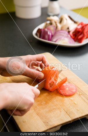 To use this stock image in your creative project, please select the size you need over to the right and click the "Add to Cart" button.
Your downloaded image will come with the Cutcaster watermark removed so don’t worry about the watermark you see on this page. Slicing Tomatoes Detail stock photo, A detail image of a woman slicing tomatoes on a cutting board at home. - shallow depth of field with the focus on the tomato and knife by Tyler Olson