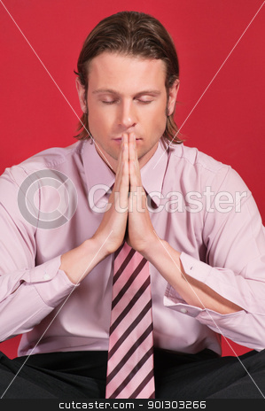 To use this stock image in your creative project, please select the size you need over to the right and click the "Add to Cart" button.
Your downloaded image will come with the Cutcaster watermark removed so don’t worry about the watermark you see on this page. Businessman with hands clasped stock photo, Close-up of a businessman with hands clasped and eyes closed in prayer posture by Tyler Olson