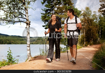 To use this stock image in your creative project, please select the size you need over to the right and click the "Add to Cart" button.
Your downloaded image will come with the Cutcaster watermark removed so don’t worry about the watermark you see on this page. Backpac Couple stock photo, A couple walking on trail with backpacks by Tyler Olson