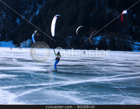 To use this stock image in your creative project, please select the size you need over to the right and click the "Add to Cart" button.
Your downloaded image will come with the Cutcaster watermark removed so don’t worry about the watermark you see on this page. kitesurf stock photo, Snowkiting on a frozen lake - winter extreme sport in Trentino Italy by freeteo