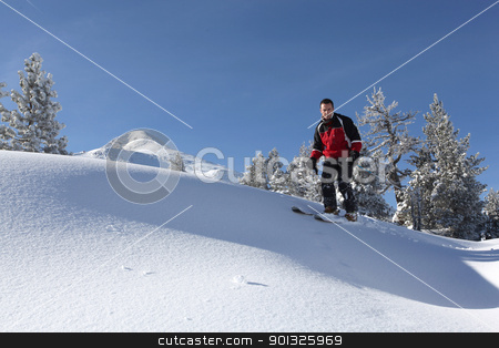 Male skier on a ski slope Male skier on a ski slope stock photo, Male skier on a ski slope by photography33