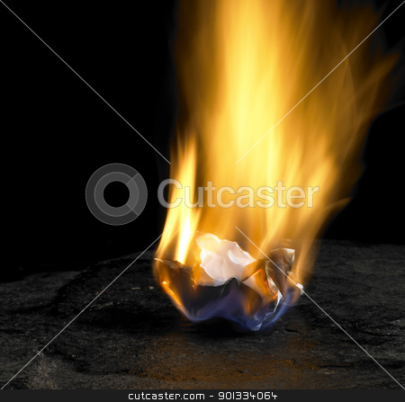 Burning paper burning paper stock photo, studio shot of burning rumpled piece of paper with big flame in dark back by prill