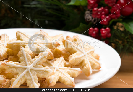 To use this stock image in your creative project, please select the size you need over to the right and click the "Add to Cart" button.
Your downloaded image will come with the Cutcaster watermark removed so don’t worry about the watermark you see on this page. Decorated star shape christmas cookies stock photo, Decorated christmas cookies in festive setting with tree decoration by Ulrich Schade