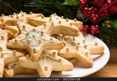 Decorated christmas cookies in festive setting Decorated christmas cookies in festive setting stock photo, Decorated christmas cookies in festive setting with tree decoration by Ulrich Schade
