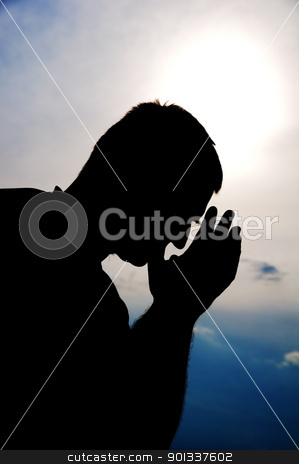 Prayer silhouette Prayer silhouette stock photo, Praying man. Silhouette. by Iryna Rasko