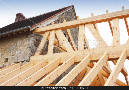 Construction of the wooden frame of a roof construction of the wooden frame of a roof stock photo, construction of the wooden frame of a roof by Chretien