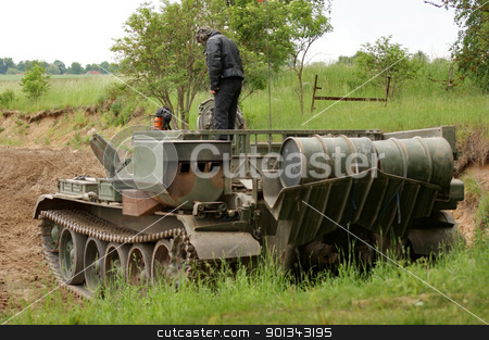 Offroad scenery with driving tank offroad scenery with driving tank stock photo, old tank of the Nationale Volksarmee in Germany, now used for a private tank driving school, while driving on earthy ground by prill