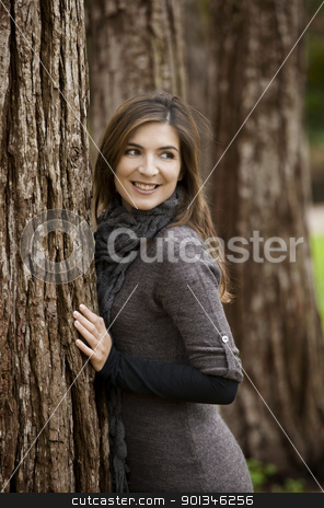 To use this stock image in your creative project, please select the size you need over to the right and click the "Add to Cart" button.
Your downloaded image will come with the Cutcaster watermark removed so don’t worry about the watermark you see on this page. Happy woman stock photo, Portrait of a beautiful young woman posing near a tree by ikostudio