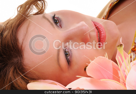 To use this stock image in your creative project, please select the size you need over to the right and click the "Add to Cart" button.
Your downloaded image will come with the Cutcaster watermark removed so don’t worry about the watermark you see on this page. Sensuality glance stock photo, Close-up beauty woman face with lily flowers by Iryna Rasko