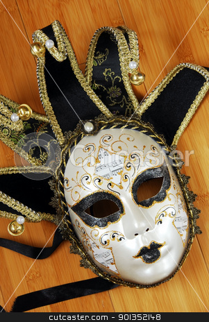 To use this stock image in your creative project, please select the size you need over to the right and click the "Add to Cart" button.
Your downloaded image will come with the Cutcaster watermark removed so don’t worry about the watermark you see on this page. Venice mask stock photo, venice black and white mask with golden details by Julija Sapic