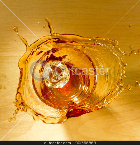 To use this stock image in your creative project, please select the size you need over to the right and click the "Add to Cart" button.
Your downloaded image will come with the Cutcaster watermark removed so don’t worry about the watermark you see on this page. Splash of whiskey stock photo, Top shot with an icecube splashing in a glass of whiskey on a wooden background. by Han van Vonno
