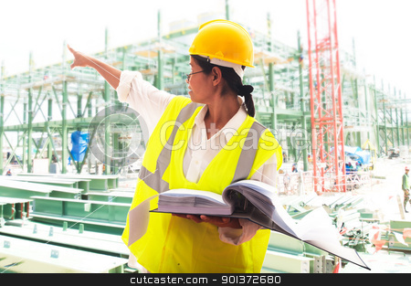 Engineer at work Engineer at work stock photo, A woman working as an engineer in a yellow safety vest and yellow helmet by p.studio66
