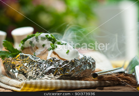 To use this stock image in your creative project, please select the size you need over to the right and click the "Add to Cart" button.
Your downloaded image will come with the Cutcaster watermark removed so don’t worry about the watermark you see on this page. Outdoor photo of an baked potato in a aluminum-foil stock photo, Outdoor photo of an baked potato in a aluminum-foil by p.studio66