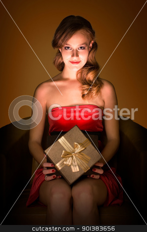 To use this stock image in your creative project, please select the size you need over to the right and click the "Add to Cart" button.
Your downloaded image will come with the Cutcaster watermark removed so don’t worry about the watermark you see on this page. Magical gift. stock photo, Portrait of beautiful smling realxed young blond with magical gift box. by exvivo