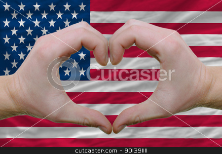 To use this stock image in your creative project, please select the size you need over to the right and click the "Add to Cart" button.
Your downloaded image will come with the Cutcaster watermark removed so don’t worry about the watermark you see on this page. Heart and love gesture showed by hands over flag of usa backgrou stock photo, Gesture made by hands showing symbol of heart and love over american flag by Vedran Vukoja