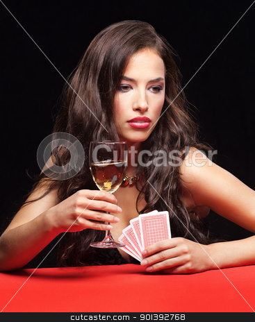 Young woman gambling on red table young woman gambling on red table stock photo, pretty young woman gambling on red table by iMarin