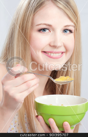 To use this stock image in your creative project, please select the size you need over to the right and click the "Add to Cart" button.
Your downloaded image will come with the Cutcaster watermark removed so don’t worry about the watermark you see on this page. Smiled woman holding spoon and plate stock photo, Smiled woman holding spoon and plate, preparing to eat cornflex by iMarin