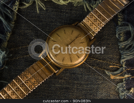 To use this stock image in your creative project, please select the size you need over to the right and click the "Add to Cart" button.
Your downloaded image will come with the Cutcaster watermark removed so don’t worry about the watermark you see on this page. Vintage golden wristwatch. stock photo, Retro golden wristwatch close up over blue jean cloth background. by Cienpies Design