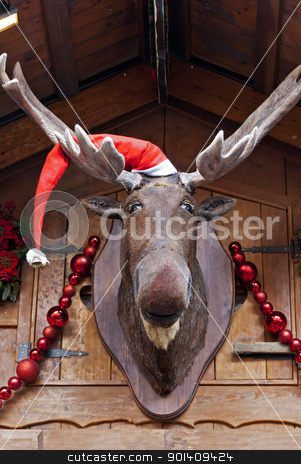 Christmas Moose Christmas Moose stock photo, Elk in Santa cap at Christmas market by Valentyna Chukhlyebova