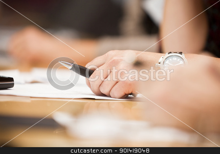 To use this stock image in your creative project, please select the size you need over to the right and click the "Add to Cart" button.
Your downloaded image will come with the Cutcaster watermark removed so don’t worry about the watermark you see on this page. Hand with a pen stock photo, Human hand holding a pencil on a table by Anne-Louise Quarfoth