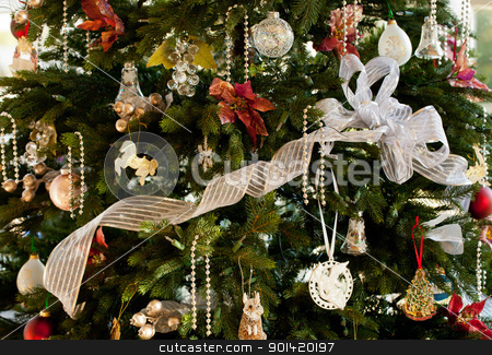 To use this stock image in your creative project, please select the size you need over to the right and click the "Add to Cart" button.
Your downloaded image will come with the Cutcaster watermark removed so don’t worry about the watermark you see on this page. Decorated christmas tree in home stock photo, Christmas tree decorated with silver and white ribbons and ornaments in family home by Steven Heap