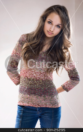 To use this stock image in your creative project, please select the size you need over to the right and click the "Add to Cart" button.
Your downloaded image will come with the Cutcaster watermark removed so don’t worry about the watermark you see on this page. Beautiful fashionable brunette model. stock photo, Half length portrait of beautiful fashionable brunette model in jeans and floral pattern sweater. by exvivo