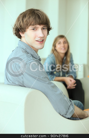 To use this stock image in your creative project, please select the size you need over to the right and click the "Add to Cart" button.
Your downloaded image will come with the Cutcaster watermark removed so don’t worry about the watermark you see on this page. Teenagers hanging out in a lounge stock photo, Teenagers hanging out in a lounge by photography33