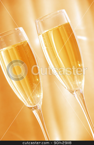 Two glasses of champagne Two glasses of champagne stock photo, Two glasses of champagne against golden background by sutike