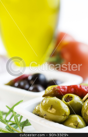 To use this stock image in your creative project, please select the size you need over to the right and click the "Add to Cart" button.
Your downloaded image will come with the Cutcaster watermark removed so don’t worry about the watermark you see on this page. Ingredients stock photo, Green and black olives, olive oil, tomato and herbs by klenova