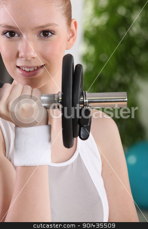 To use this stock image in your creative project, please select the size you need over to the right and click the "Add to Cart" button.
Your downloaded image will come with the Cutcaster watermark removed so don’t worry about the watermark you see on this page. Young woman using a barbell stock photo, Young woman using a barbell by photography33