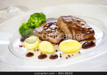 To use this stock image in your creative project, please select the size you need over to the right and click the "Add to Cart" button.
Your downloaded image will come with the Cutcaster watermark removed so don’t worry about the watermark you see on this page. Steaks stock photo, Close up photograph of a gourmet dish with steaks and potatoes by mpessaris