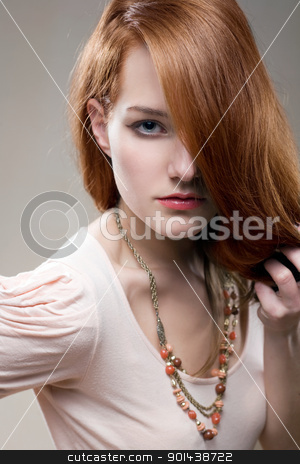 Artistic portrait of gorgeous young redhead. Artistic portrait of gorgeous young redhead. stock photo, Artistic portrait of gorgeous young redhead with intense look on her face. by exvivo