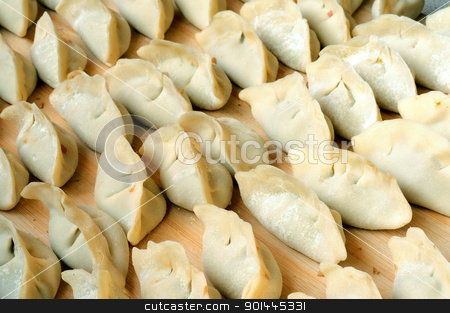 To use this stock image in your creative project, please select the size you need over to the right and click the "Add to Cart" button.
Your downloaded image will come with the Cutcaster watermark removed so don’t worry about the watermark you see on this page. Chinese raw dumplings stock photo, Chinese raw dumplings ready for being boiled by John Young