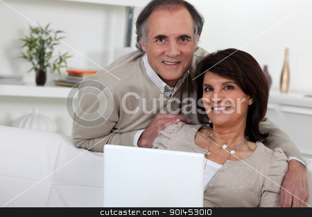 Middle-aged couple with laptop Middle-aged couple with laptop stock photo, Middle-aged couple with laptop by photography33