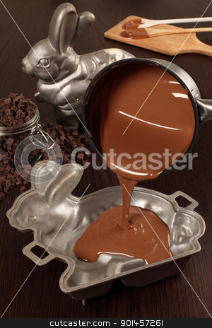 To use this stock image in your creative project, please select the size you need over to the right and click the "Add to Cart" button.
Your downloaded image will come with the Cutcaster watermark removed so don’t worry about the watermark you see on this page. Making chocolate Easter bunny stock photo, Photo of melted milk chocolate being poured into a aluminum mold of a bunny for an Easter treat. by © Ron Sumners