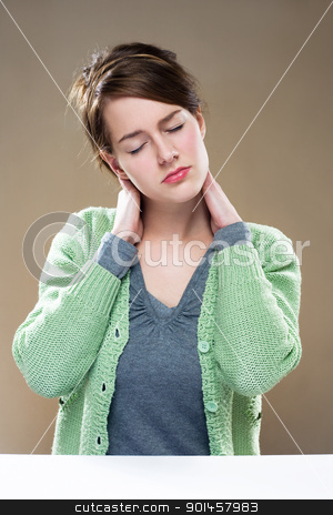 Wasted... Wasted... stock photo, Gorgeous young brunette woman showing symptoms of neck pain. by exvivo