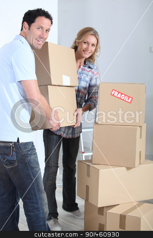 To use this stock image in your creative project, please select the size you need over to the right and click the "Add to Cart" button.
Your downloaded image will come with the Cutcaster watermark removed so don’t worry about the watermark you see on this page. Couple stacking boxes stock photo, Couple stacking boxes by photography33