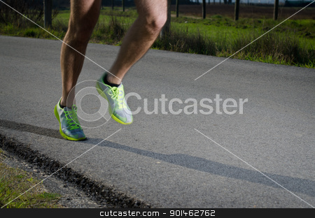 To use this stock image in your creative project, please select the size you need over to the right and click the "Add to Cart" button.
Your downloaded image will come with the Cutcaster watermark removed so don’t worry about the watermark you see on this page. Running stock photo, Running sport shoes outdoors in action on country road. Male shoes on young man training. Slight motion blur, focus on back running shoe. by Homydesign