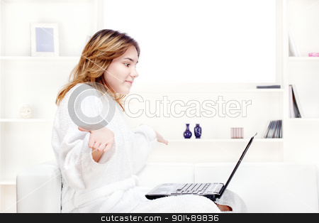 Teenage girl at home in bathrobe chatting on computer teenage girl at home in bathrobe chatting on computer stock photo, teenage girl at home in bathrobe chatting on computer by iMarin