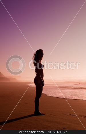 Woman silhouette on the beach Woman silhouette on the beach stock photo, Female silhouette of a beautiful young girl on the beach at the sunset by ikostudio