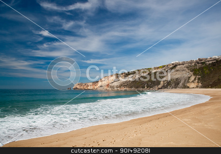 To use this stock image in your creative project, please select the size you need over to the right and click the "Add to Cart" button.
Your downloaded image will come with the Cutcaster watermark removed so don’t worry about the watermark you see on this page. Beautiful beach stock photo, Landscape picture of the beautiful beach from Nazare, Portugal by ikostudio