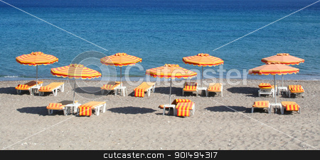 Greece. Kos island. Kefalos beach Greece. Kos island. Kefalos beach stock photo, Greece. Kos island. Kefalos beach. Orange chairs and umbrellas on the beach by Morozova Oxana