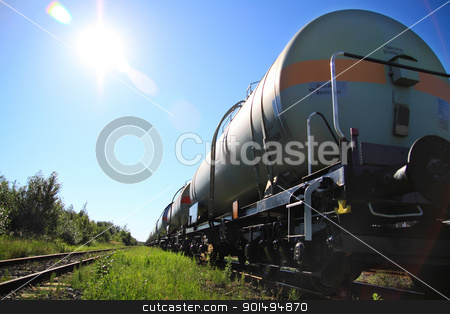 To use this stock image in your creative project, please select the size you need over to the right and click the "Add to Cart" button.
Your downloaded image will come with the Cutcaster watermark removed so don’t worry about the watermark you see on this page. Oil and fuel transportation by rail stock photo, Tanks with fuel being transported by rail, taken in backlit by Deekens